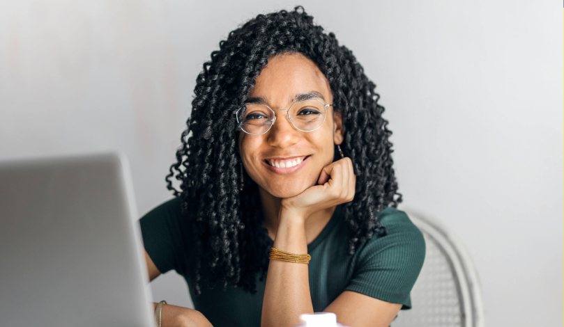 Young woman smiling at camera.